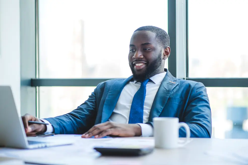 Optimized photo of a job seeker in Ghana using a laptop.